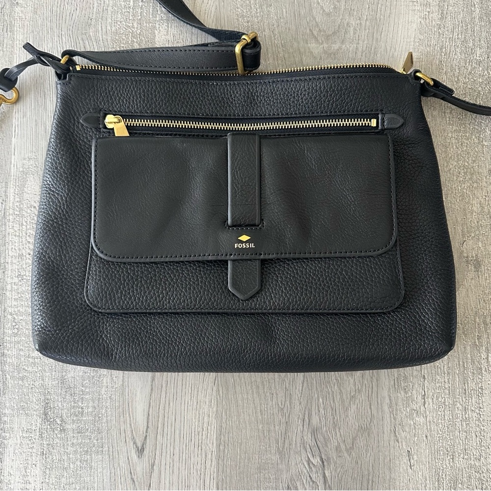 Fossil black leather crossbody with gold hardware and adjustable shoulder strap